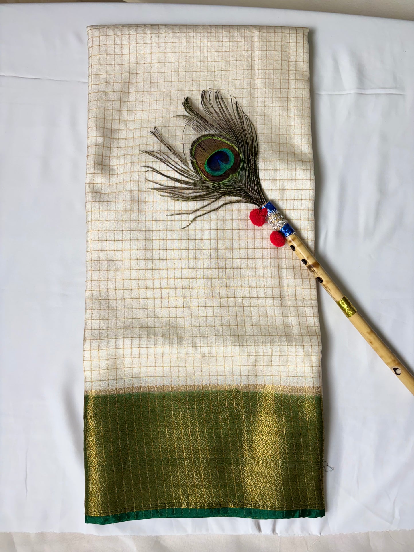 Beautiful crepe checks maroon color saree with lilac golden zari work border