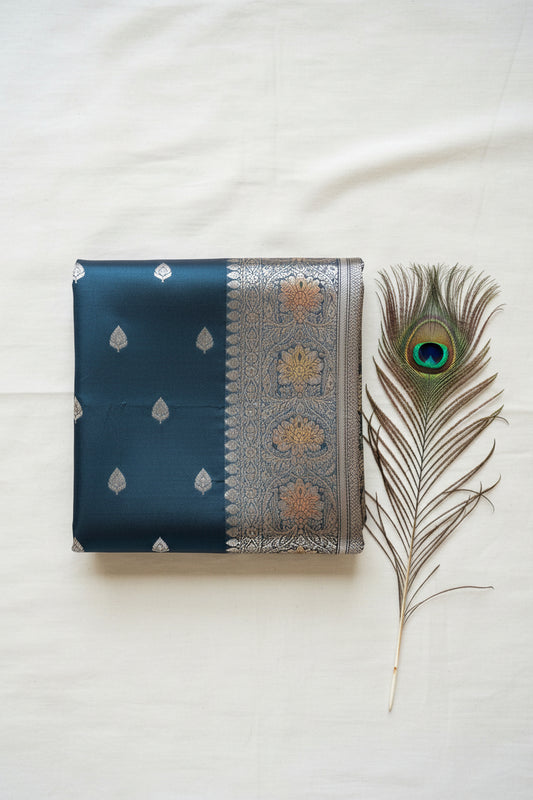 Katan banarasi saree with silver zari work.