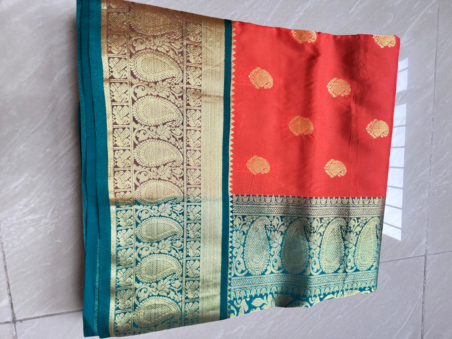 Red soft silk sare with royal blue golden zari border
