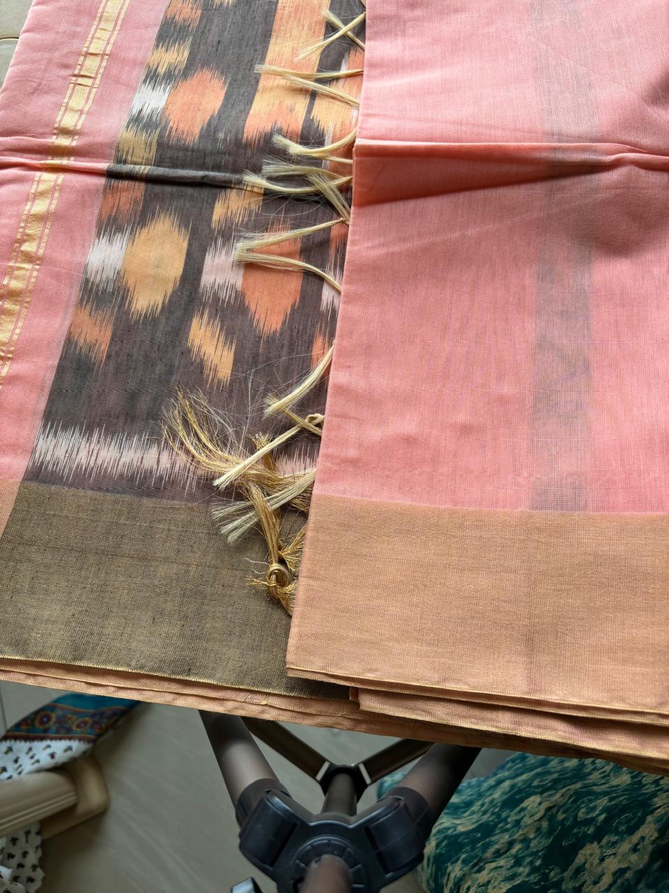 baby pink color cotton saree with ikkat design and contrast black pallu