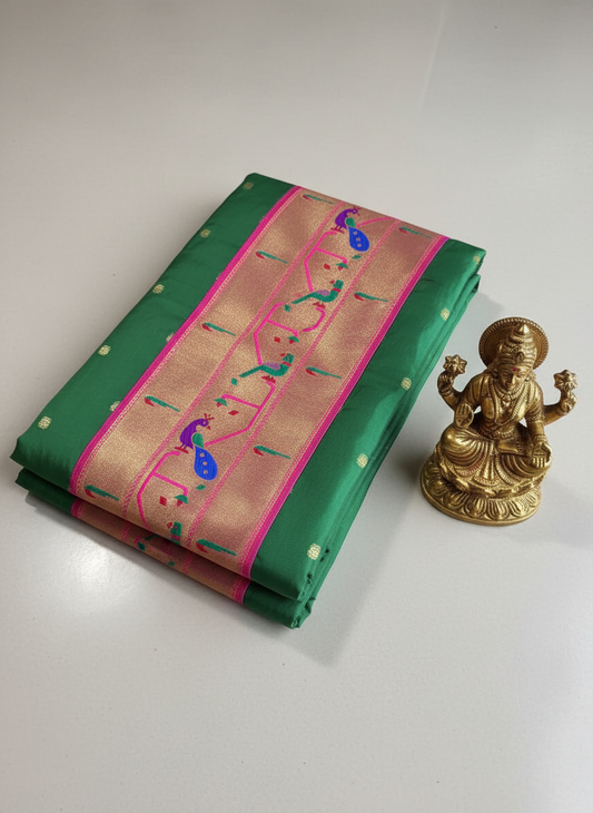 Soft silk green color muniya paithanhi with contrast rani pink color border
