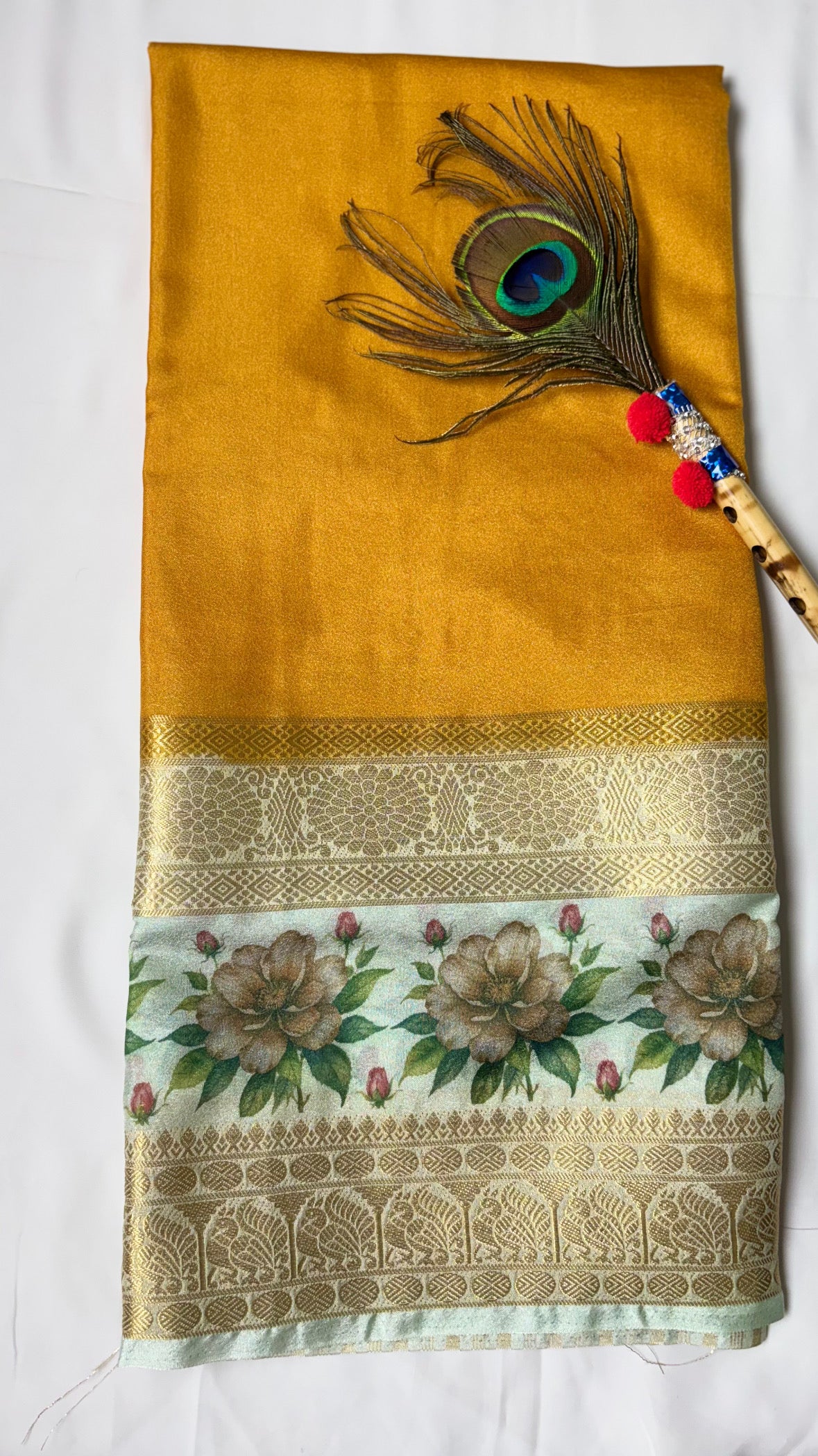 Crepe border print saree with golden zari work.