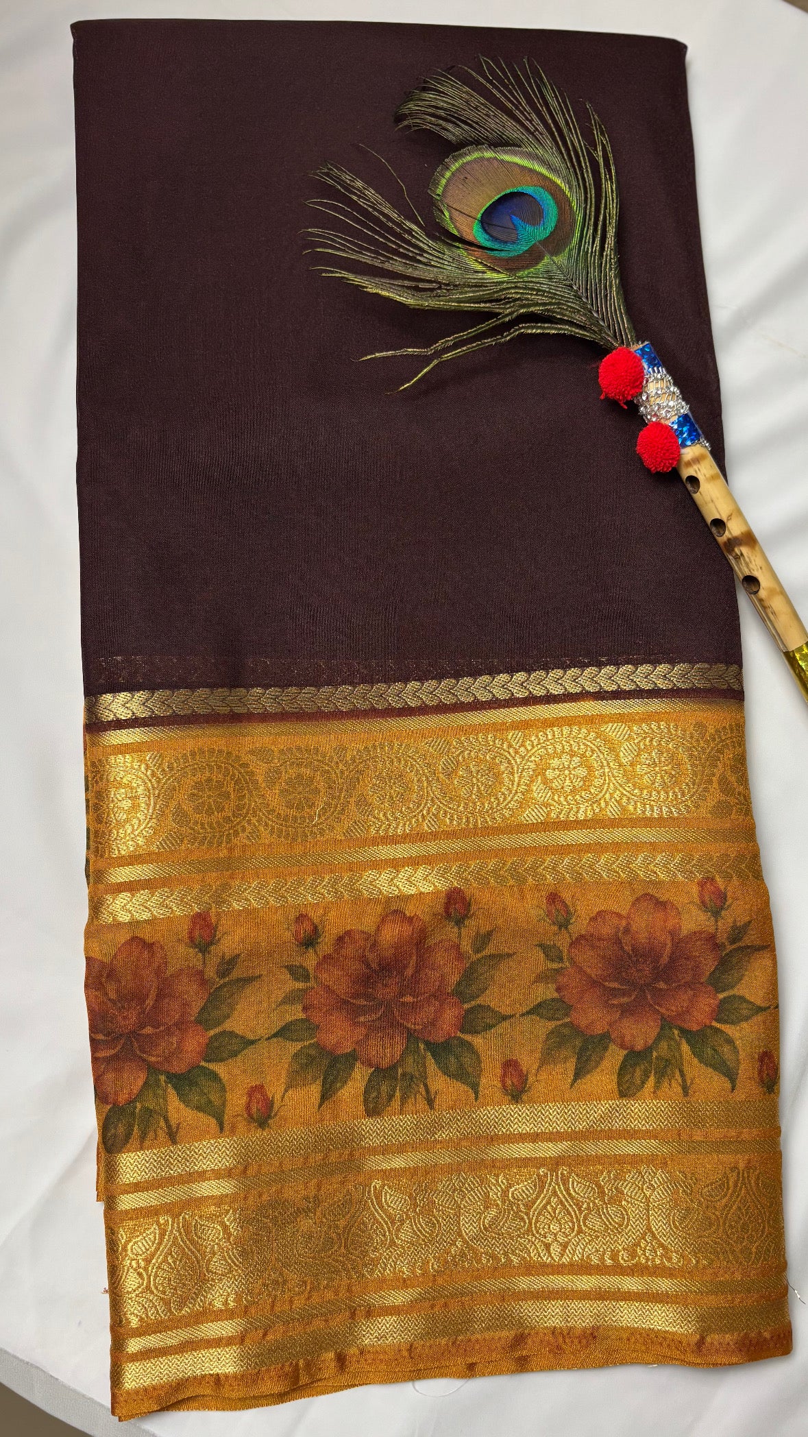Crepe border print saree with golden zari work.