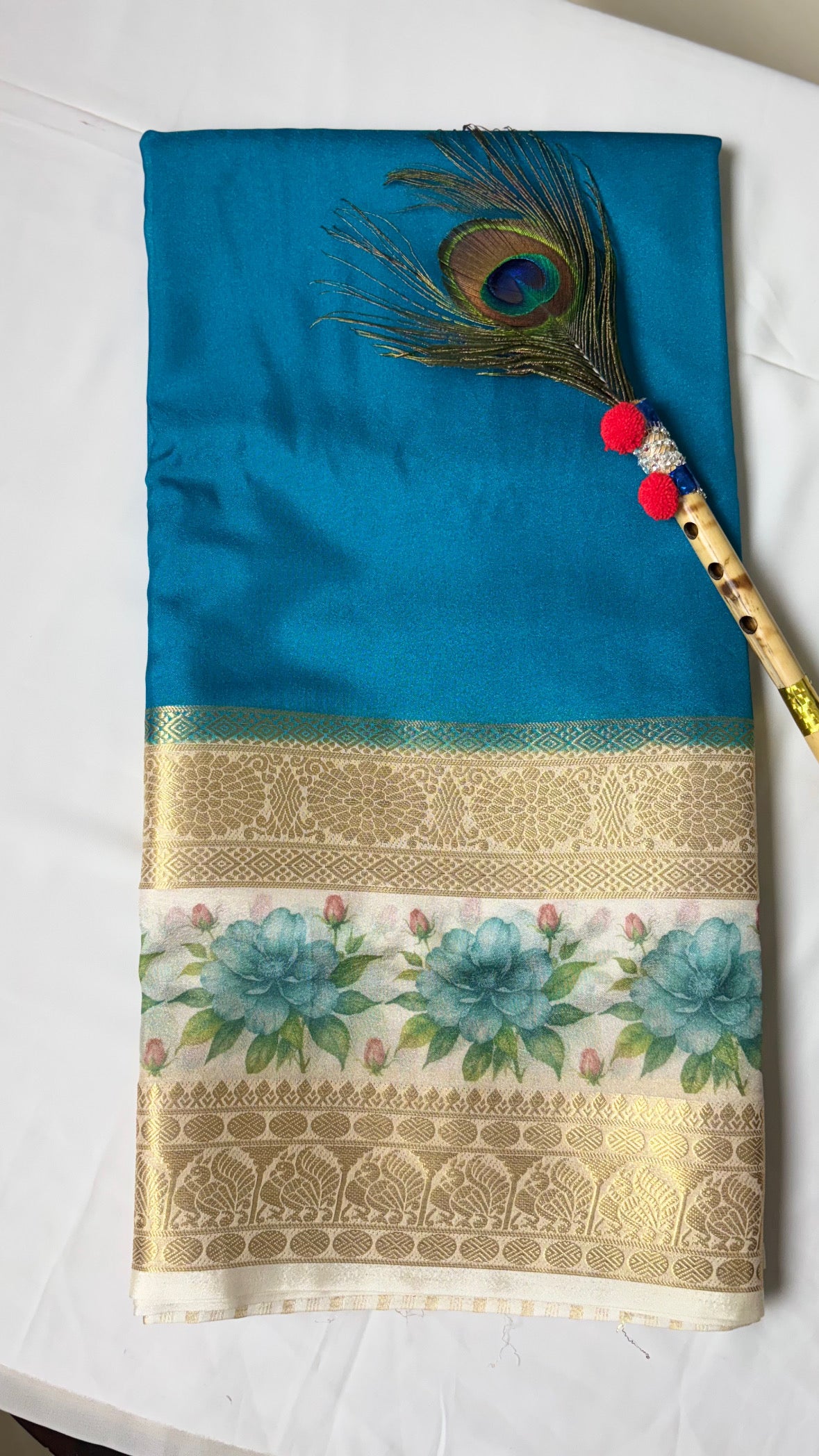 Crepe border print saree with golden zari work.