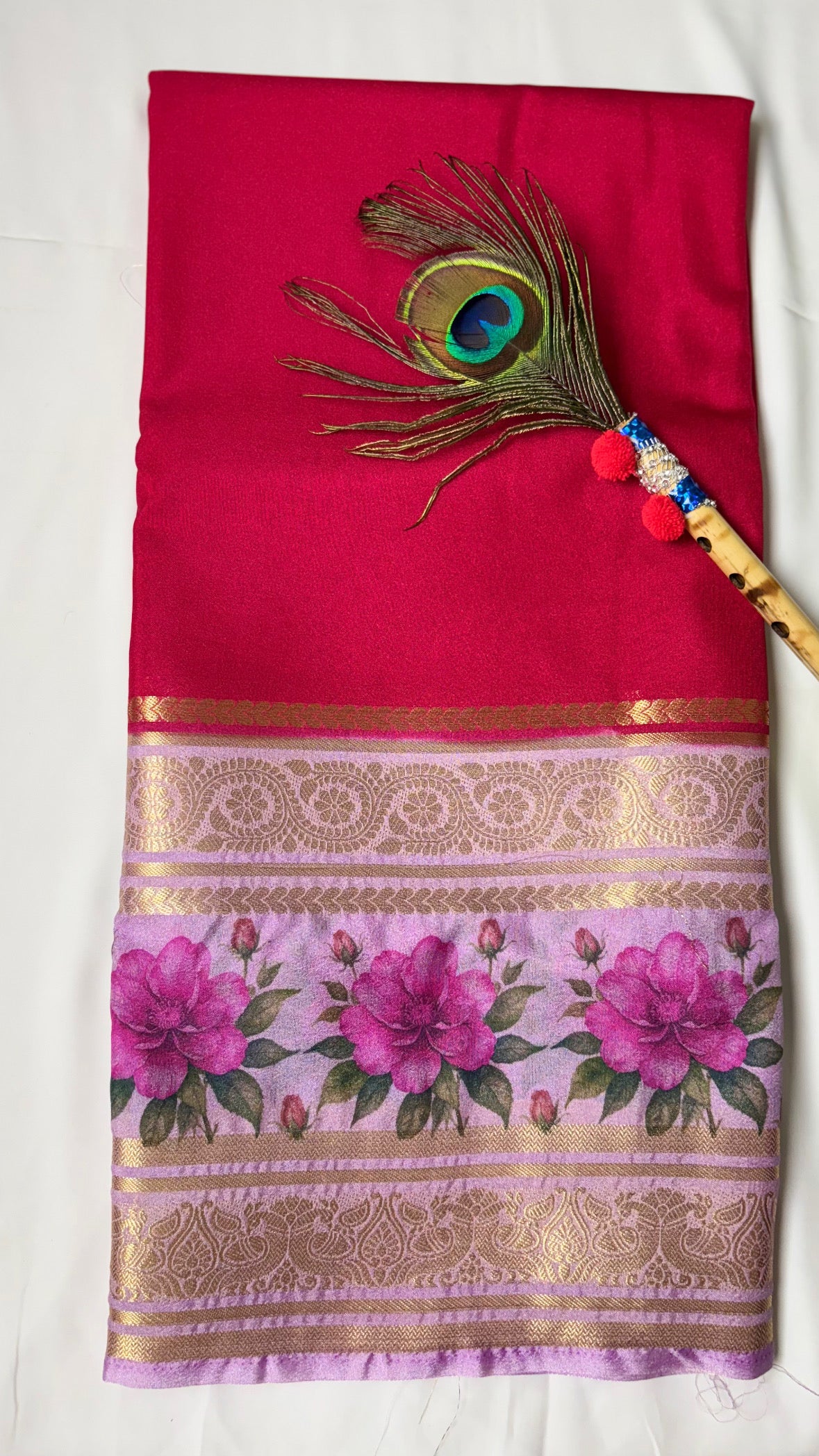 Crepe border print saree with golden zari work.