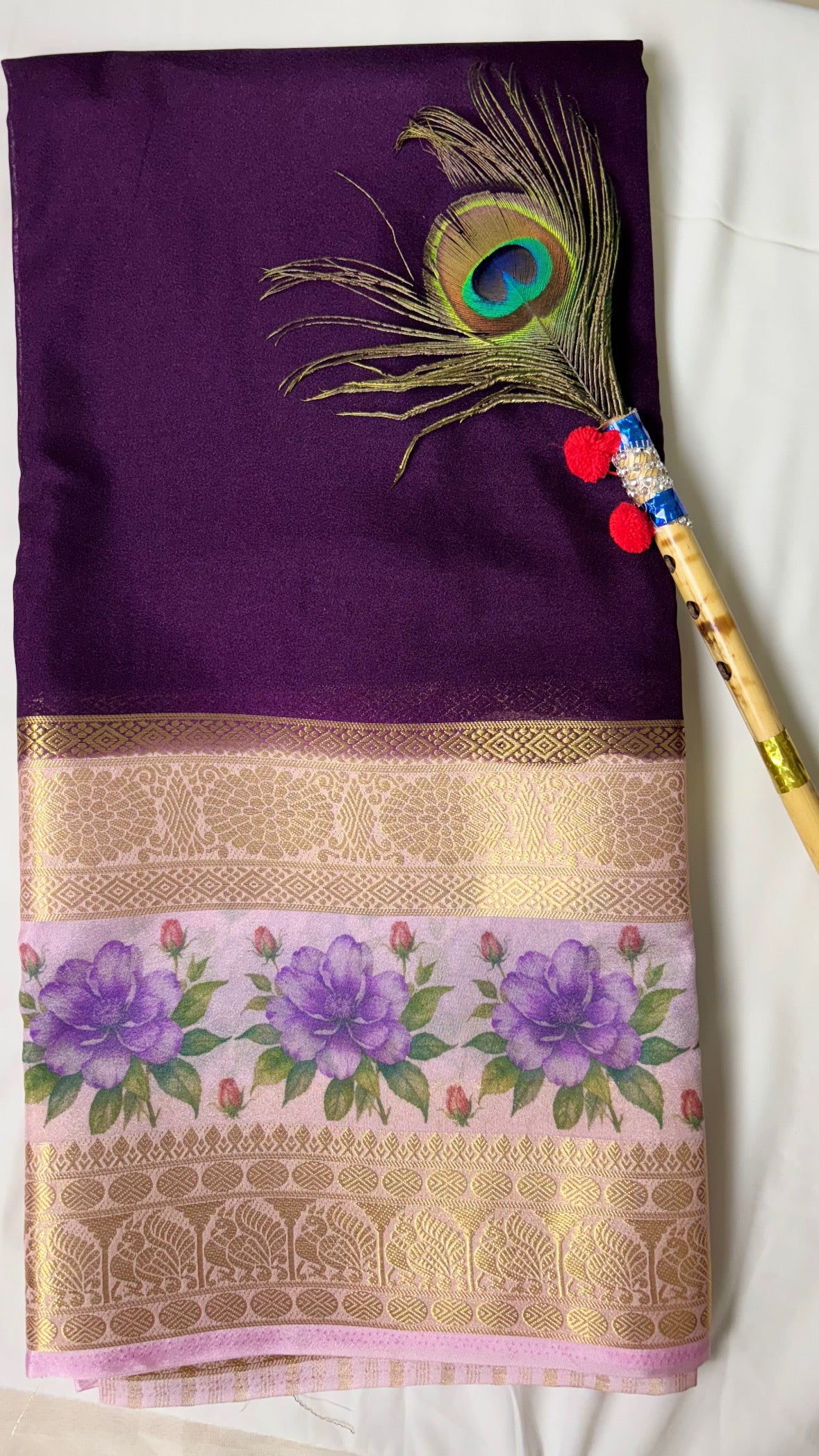 Crepe border print saree with golden zari work.