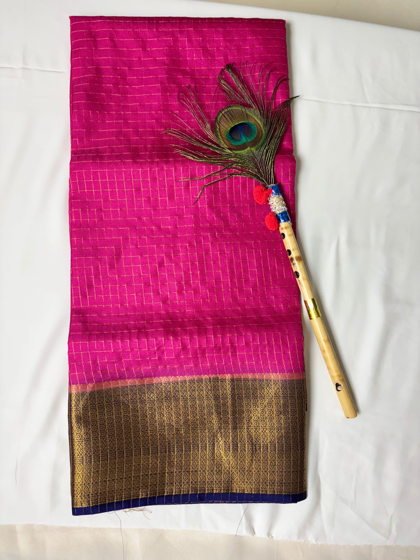 Beautiful crepe checks maroon color saree with lilac golden zari work border