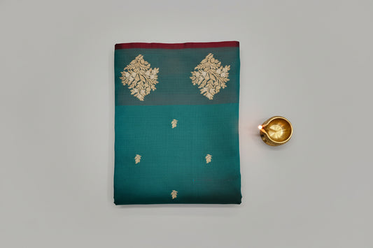 Banarasi silk blue saree with golden zari work.