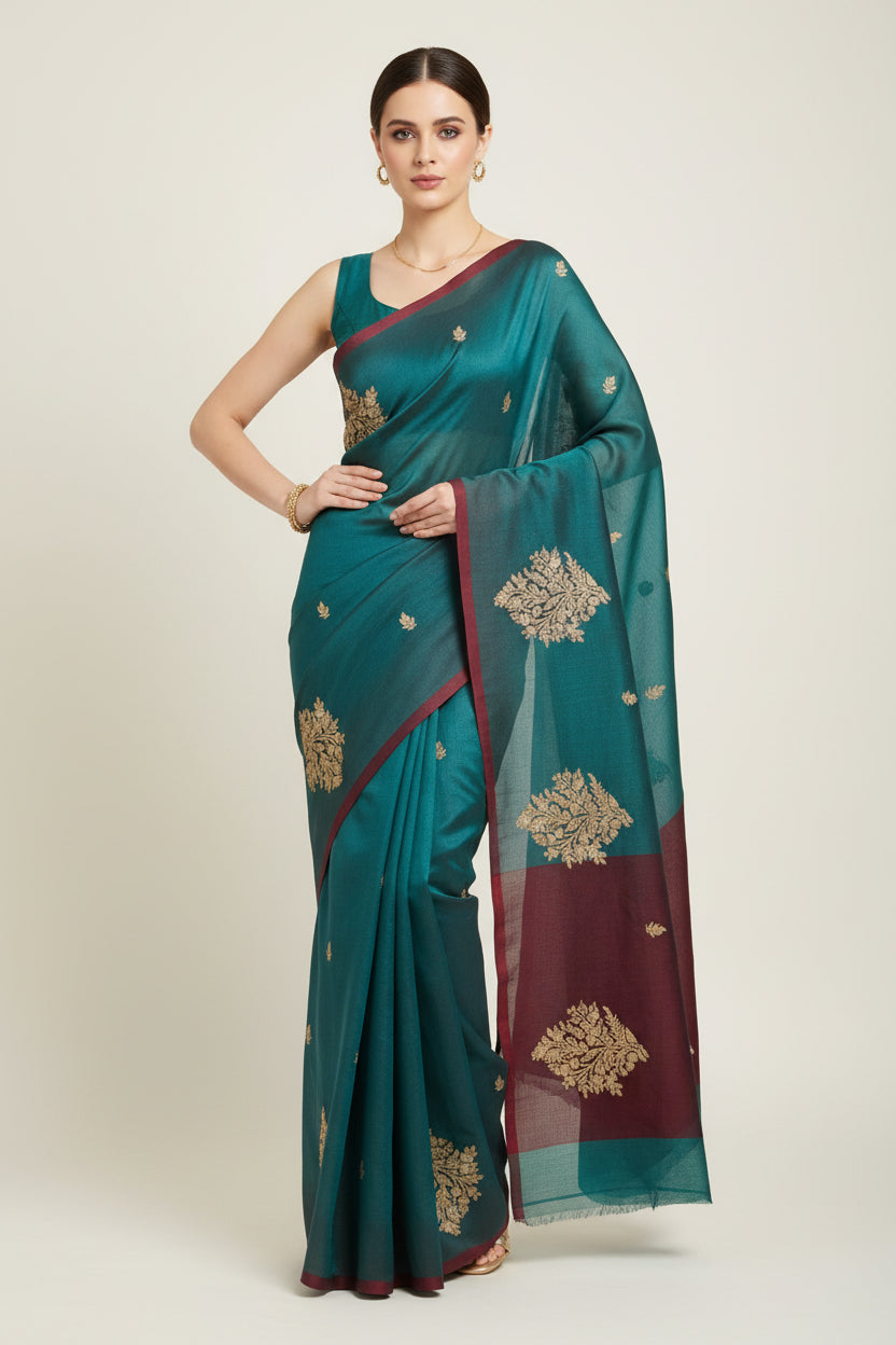 Banarasi silk blue saree with golden zari work.