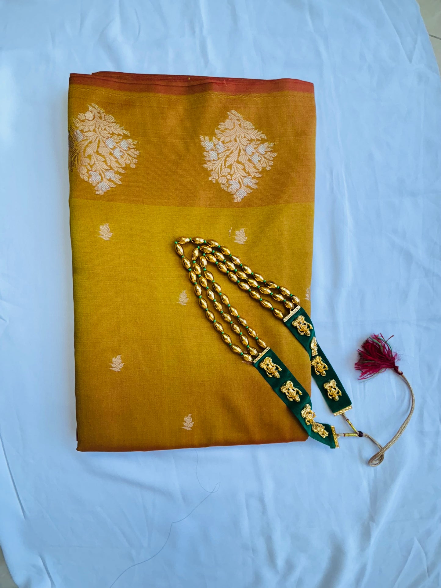 Banarasi silk blue saree with golden zari work.