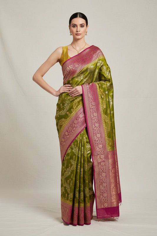 Semi crepe georgette banarasi saree with golden Zari. Mehedi color and rani pink border.