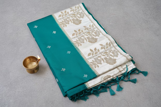 Banarasi silk saree with satin  silk border with golden zari work.
