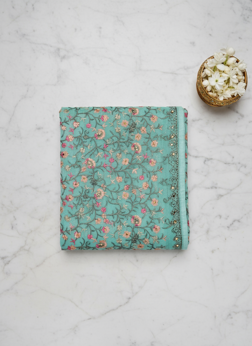 sea blue pure Chinon saree . all over interlock kashida work . and Swarovski  border.