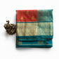 Saffron Orange Banarasi Silk Saree with Peacock Green Border and Golden Zari
