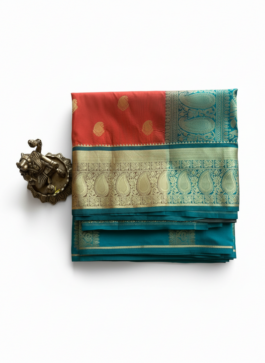 saffron orange color saree with peacock green color golden border. and golden motifs all over