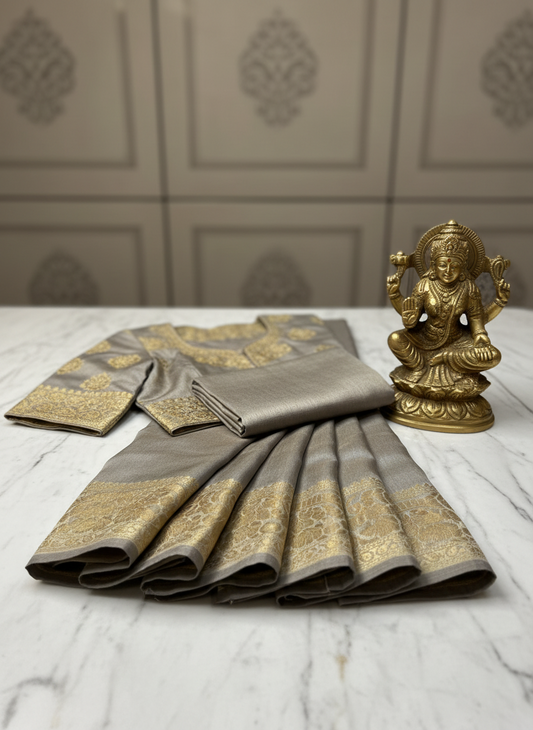 dola silk greyish- beige saree with golden zari . piping finish for saree border