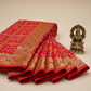 Semi goergette dark orange bandhani saree with rani pink and orange minakari work  golden  zari work