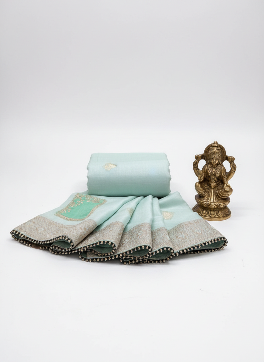 sea blue pure dola silk saree with rose gold zari work saree. with piping finish to border.