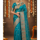 Blue saree with intricate patterns on a tiled floor