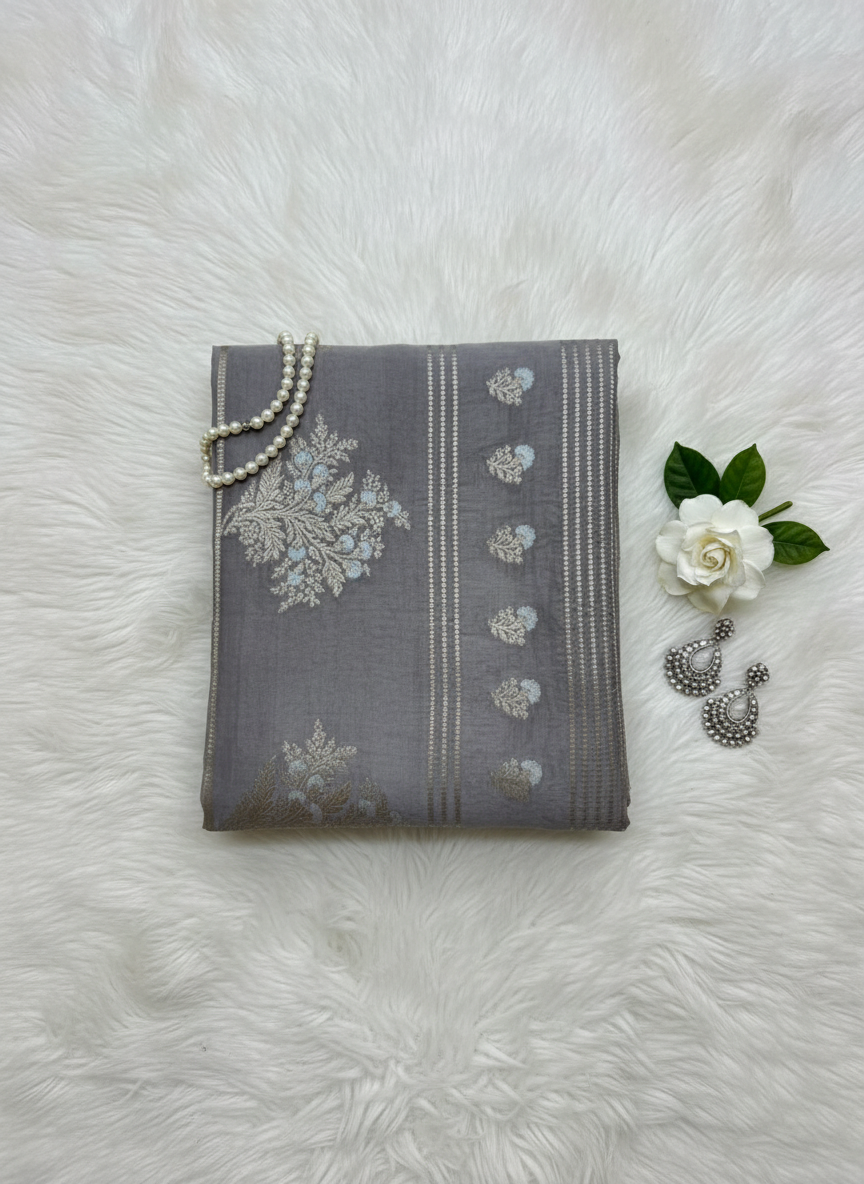 Gray fabric with floral patterns on a tiled floor