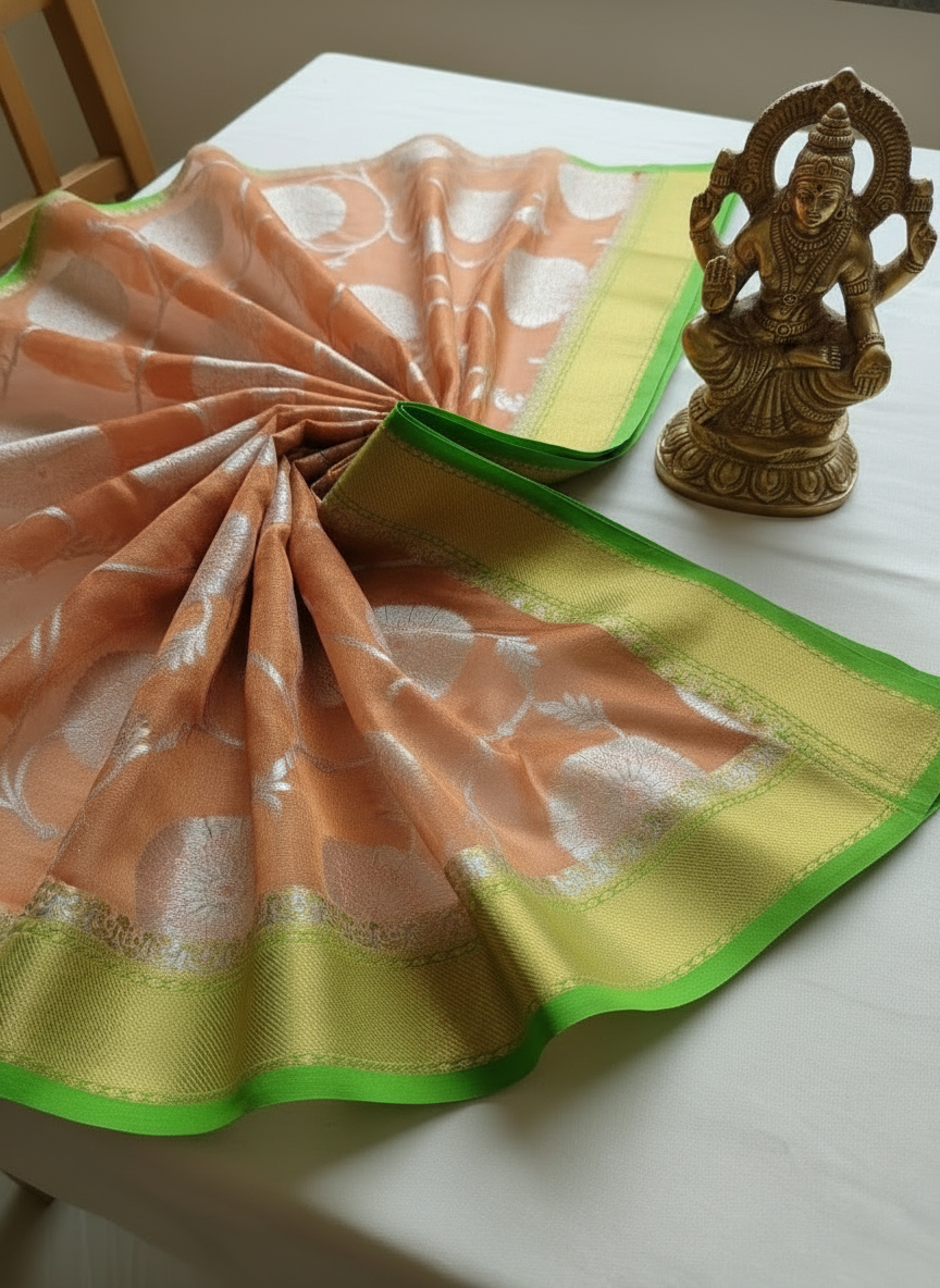 copper color organza saree ,with green border and golden zari work