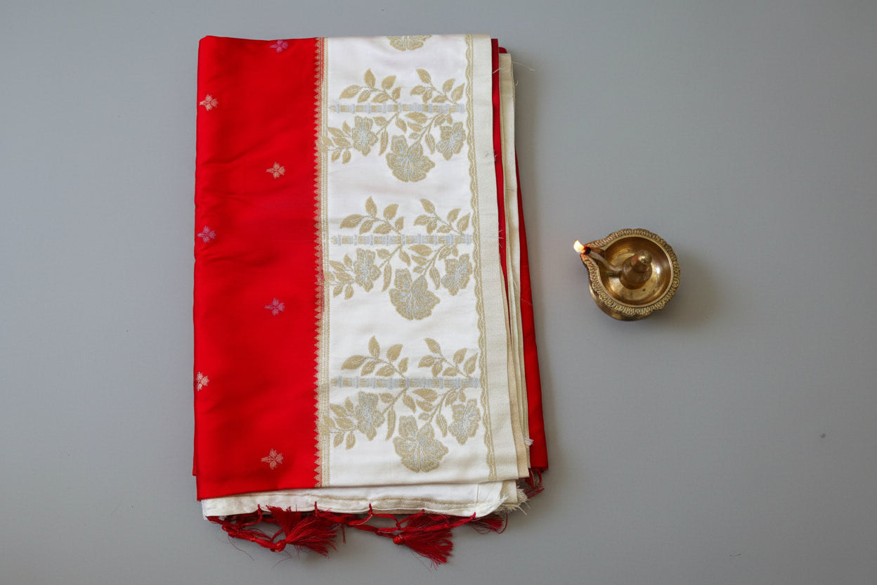 Banarasi silk saree with satin  silk border with golden zari work.