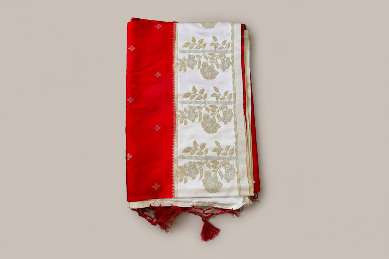 Banarasi silk saree with satin  silk border with golden zari work.