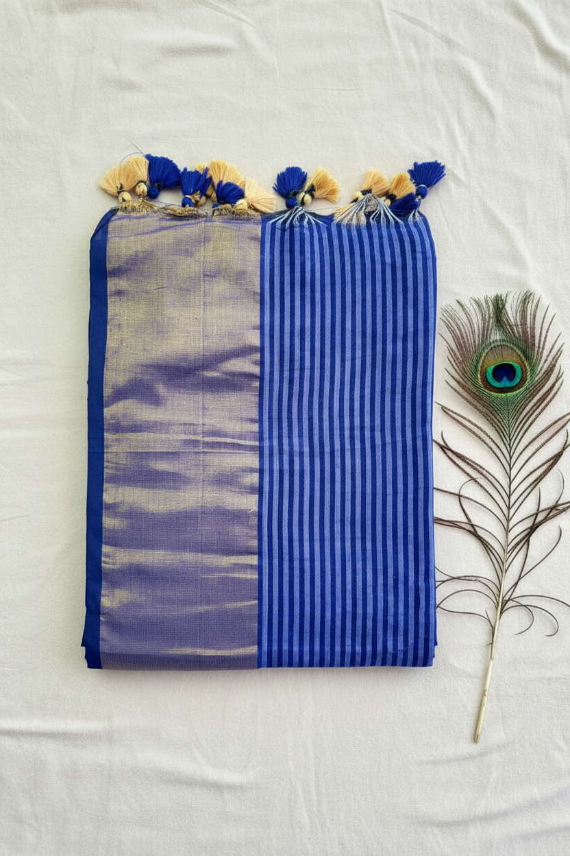 "Elegant Linen Cotton Saree featuring a rich golden zari patta border, beautifully finished with tassels on the pallu, available in vibrant colours."