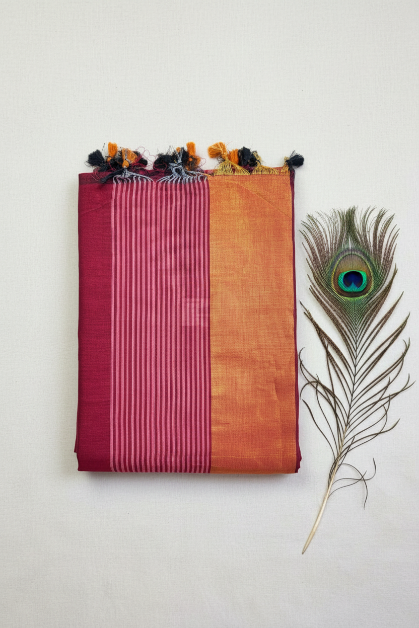 "Elegant Linen Cotton Saree featuring a rich golden zari patta border, beautifully finished with tassels on the pallu, available in vibrant colours."