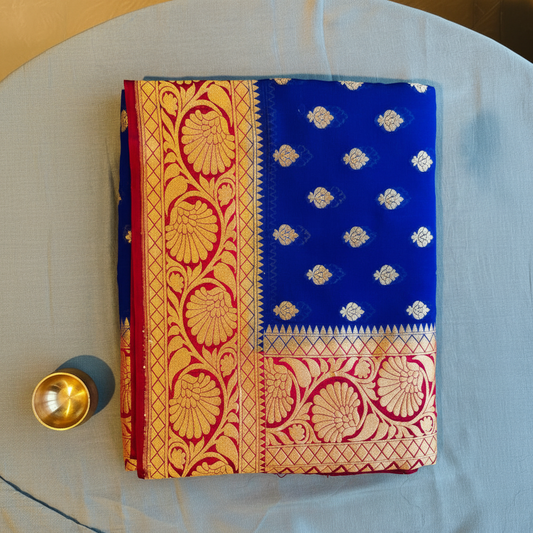 Pure khaddi goergette saree royal blue color with contrast red border