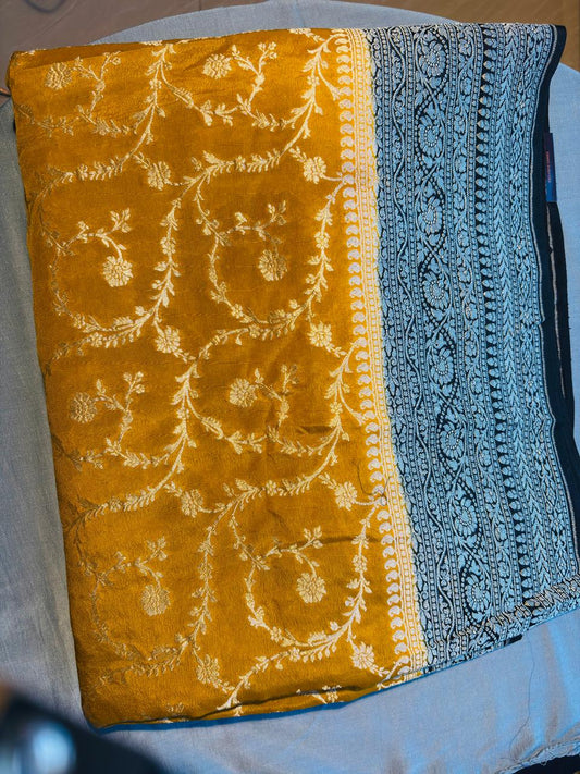 beautiful gorgeous mustard yellow color jaal pattern. black color border pure khaddi pure banarasi saree.